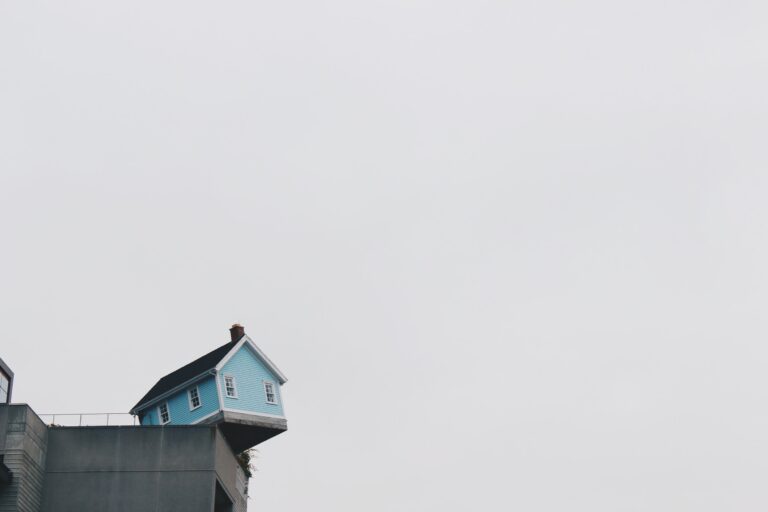 minimal image of a house on a ledge
